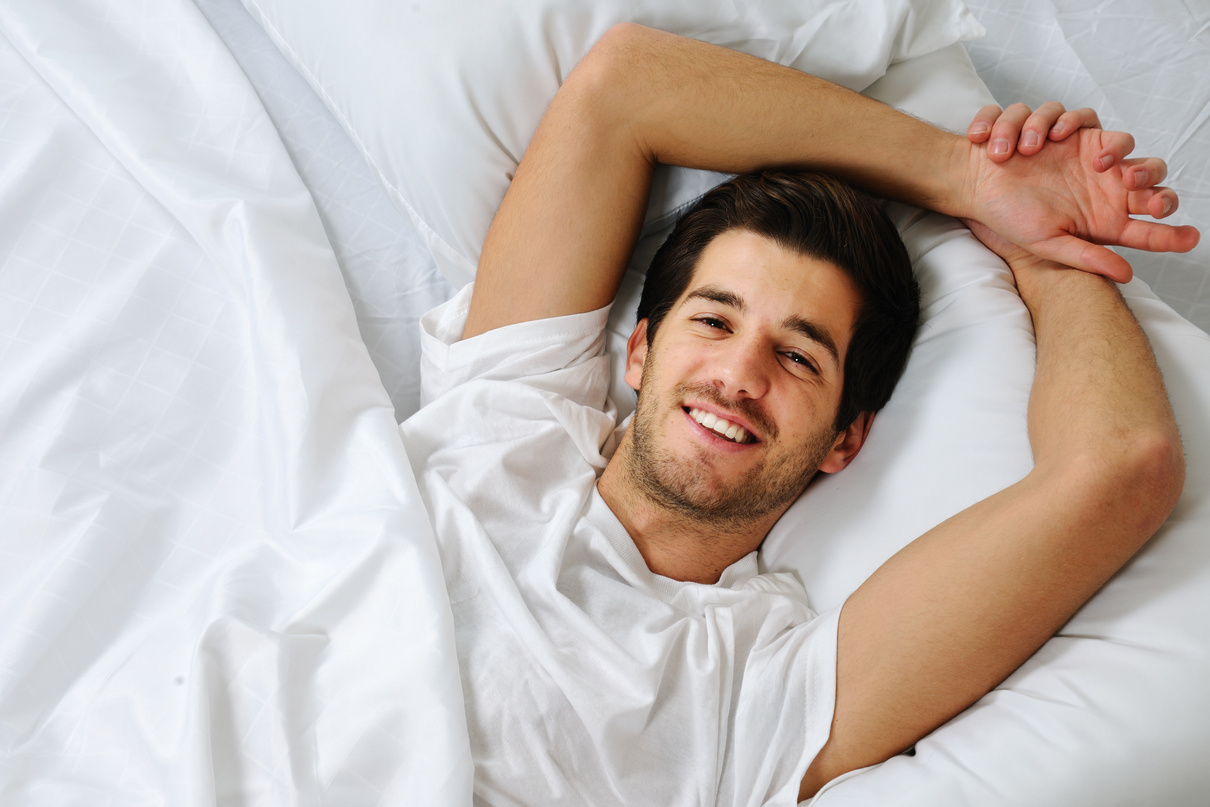 Smiling Man in Bed